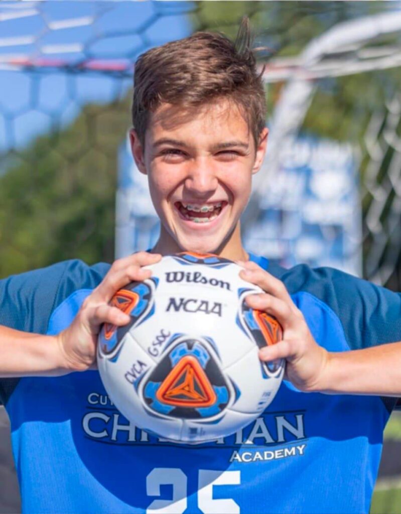 Boy smiling soccer